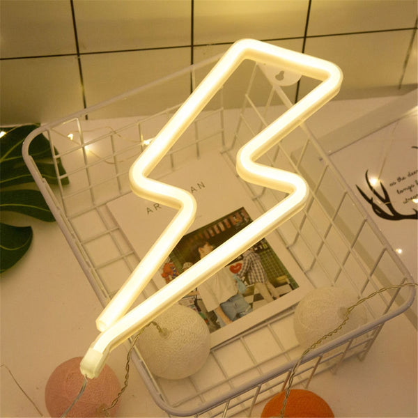 This neon light uses LED at low voltage providing just the right amount of output to catch your eye or be used as a talking point at a party or celebration. Made of acrylic it uses 3xAAA batteries, not included, or can be plugged into a USB port. Integrated hanging hook holes mean you can hang it on the wall or rest it against furniture as shown.